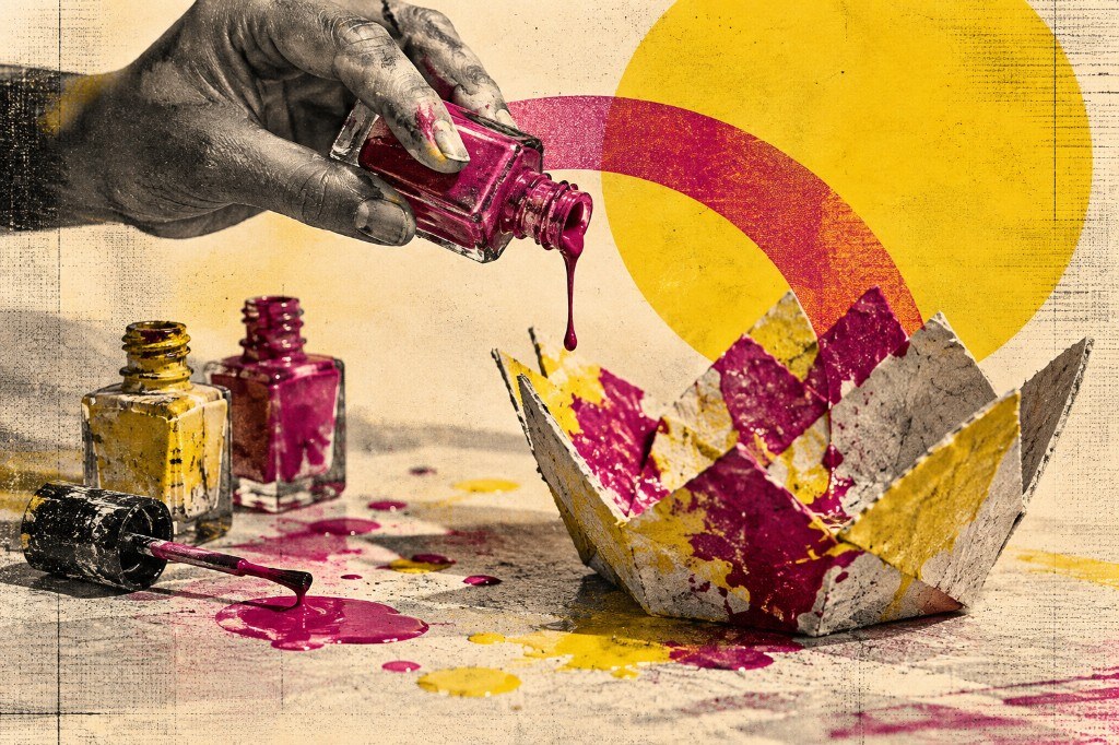 A hand pouring bright pink nail polish onto a folded paper form, with more bottles and splatters nearby